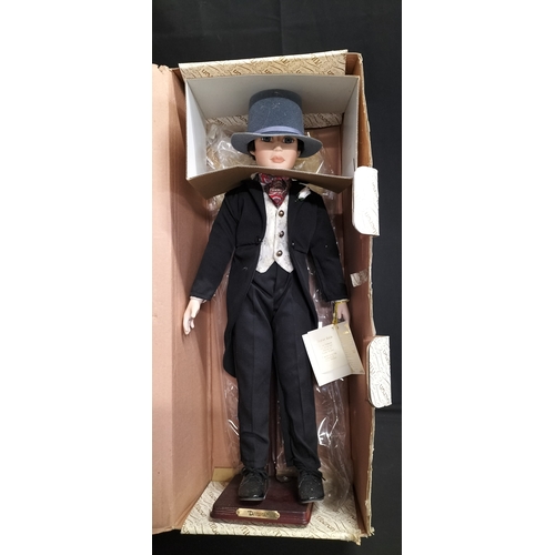 53 - Boxed Alberton Company Dominic doll on stand. Measures approx H 60.5 x 14 cm