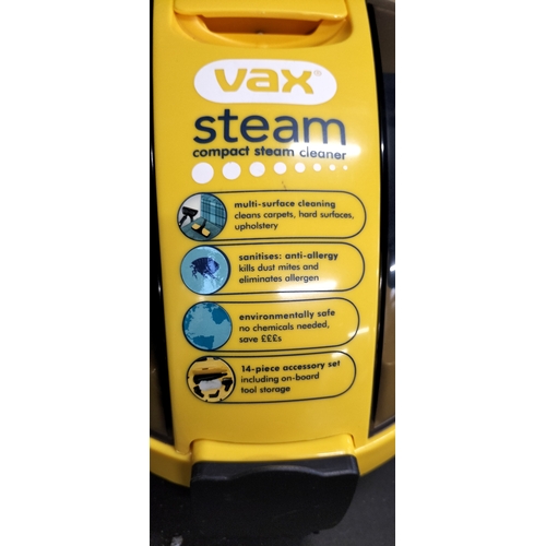 57 - Vax compact portable steam cleaner with accessories. Tested for power