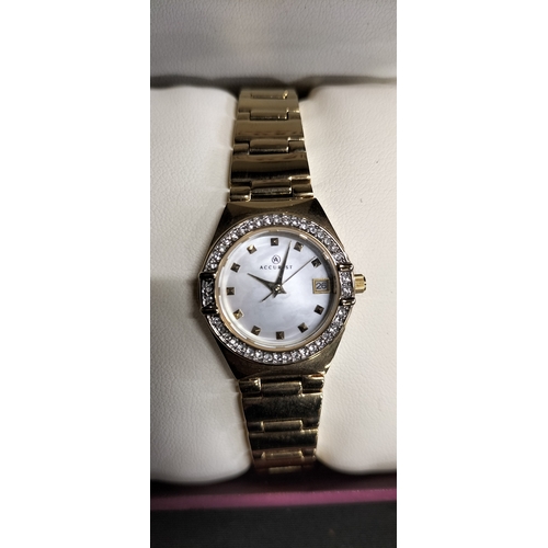 70 - Ladies Accurist gold plated watch with mother of pearl face and crystal bezel