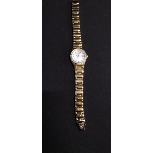 70 - Ladies Accurist gold plated watch with mother of pearl face and crystal bezel