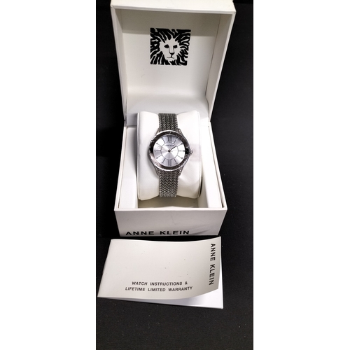 73 - Boxed Anne Klein ladies analogue watch with stainless steel strap and crystal bezel