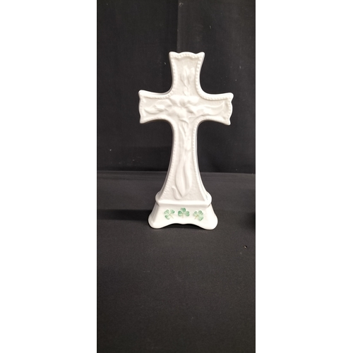 84 - Belleek porcelain cross with clover leaf decoration to the base. Measures approx H 19 x W 10 x D 4.5... 