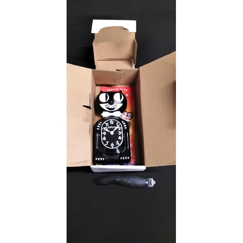 85 - Boxed battery operated Kitty-cat Klock. Measures approx H 31 x W 8.5 x D 5 cm