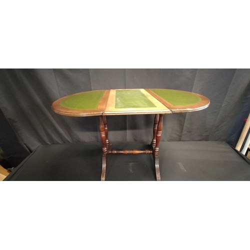 91 - Small leather topped occasional folding top  table. Measures approx H 49 x W 37.5 x D 37. Extended t... 