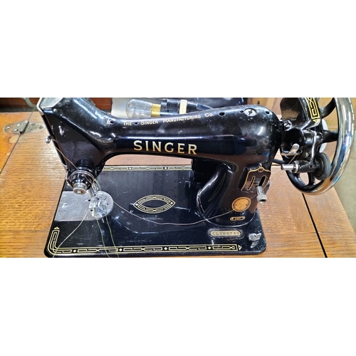 93 - Vintage singer sewing machine recessed in wooden folding sewing table. Measures approx H 82.5 x W 57... 