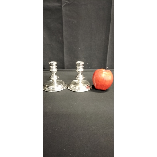 98 - Pair of Mappin and Webb White metal weighted candle holders. Measures approx  11.5 x 11 cm. Weight a... 