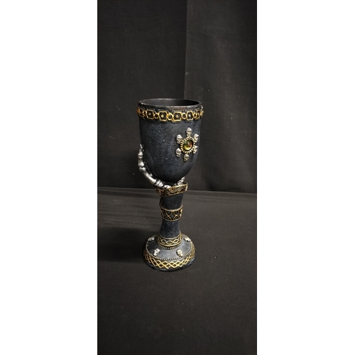 104 - Gothic style polyresin goblet with skeletal hand and crystal