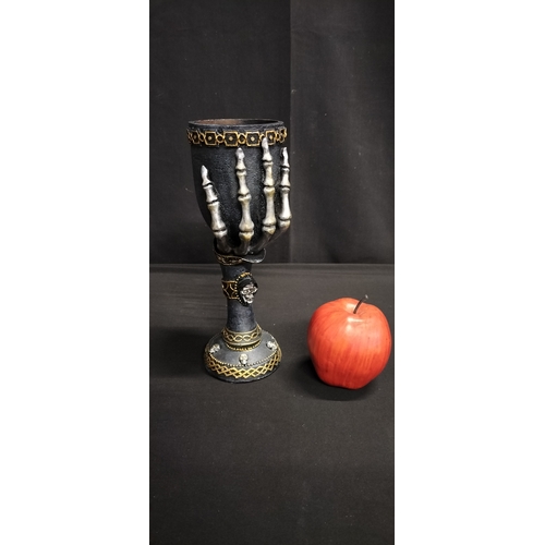 104 - Gothic style polyresin goblet with skeletal hand and crystal