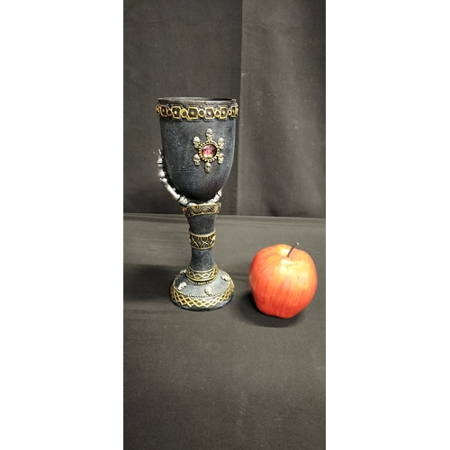 104 - Gothic style polyresin goblet with skeletal hand and crystal