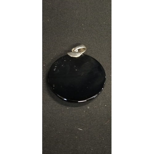 211 - Sterling silver and patterned Black agate pendant