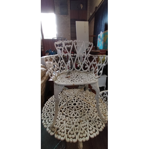 257 - White cast iron garden set. Table bench seat and chair. Collection only