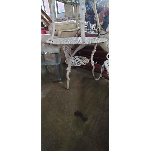 257 - White cast iron garden set. Table bench seat and chair. Collection only