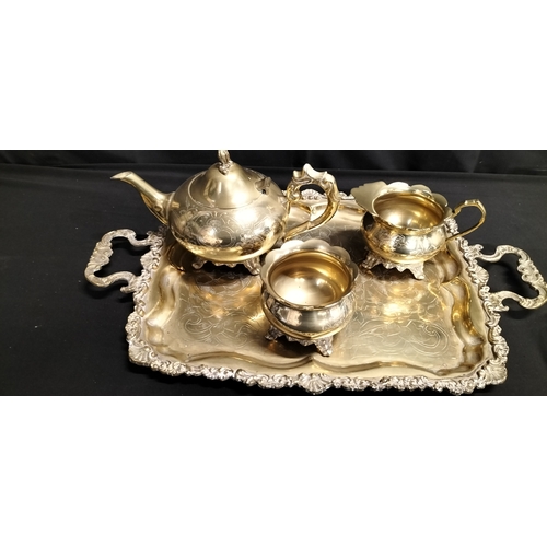 284 - Brass teapot, sugar bowl, milk jug and tray. Terracotta and bronze glaze table lamp