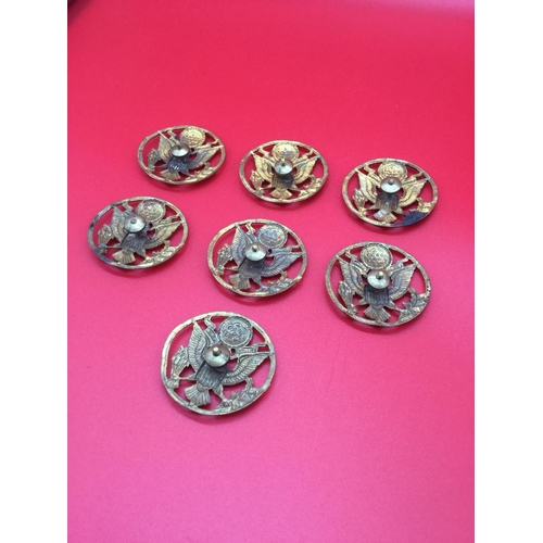 12 - 7 x American military cap badges with screw fitting.