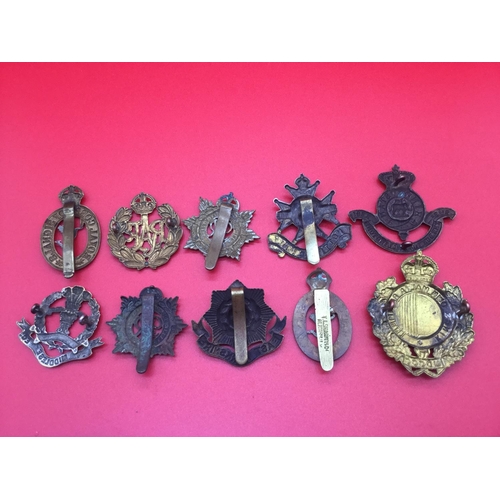 33 - Collection of 10 military cap & collar badges