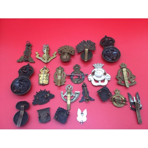 34 - Collection of 21 military cap badges and collar badges