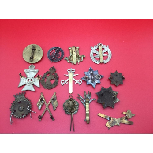 35 - Collection of 15 military cap badges and collar badges