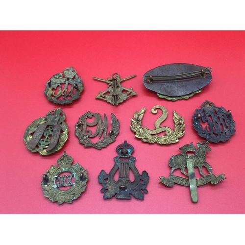 36 - Collection of 10 military cap & collar badges