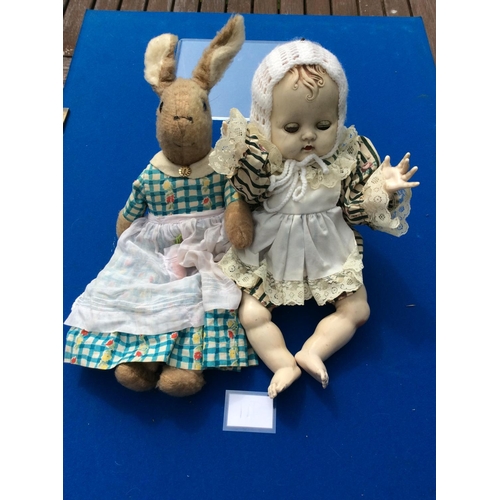 110 - hard plastic vintage doll and early rabbit soft toy est 10-20