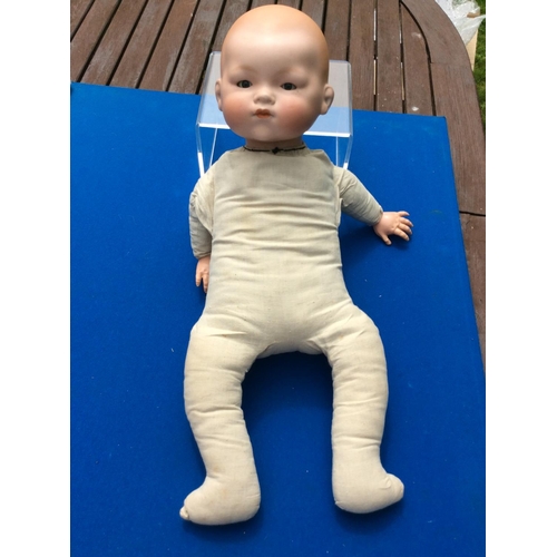 114 - armand Marseille bisque baby doll with cloth body 20 est 30-40