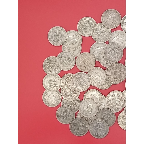 55 - Large quantity of 50% silver Half Crowns. 777 grams