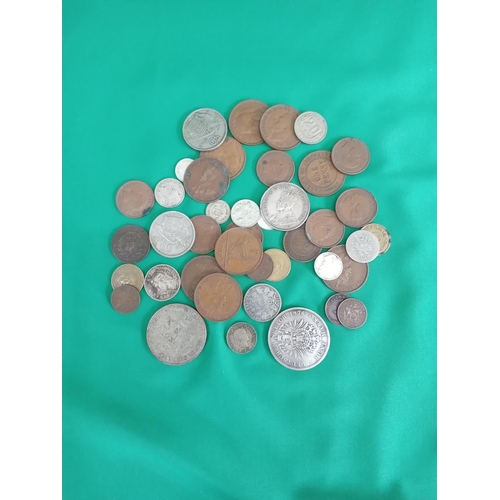 56 - Mixed foreign coins 286 grams