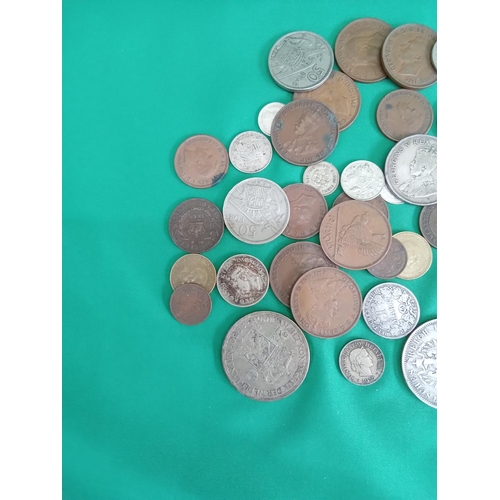 56 - Mixed foreign coins 286 grams