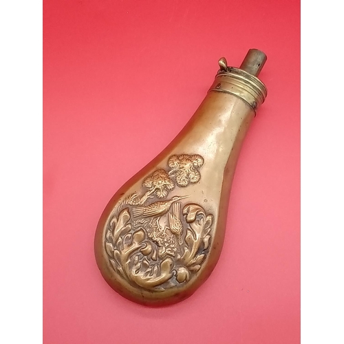 72 - Antique powder flask with ornate design