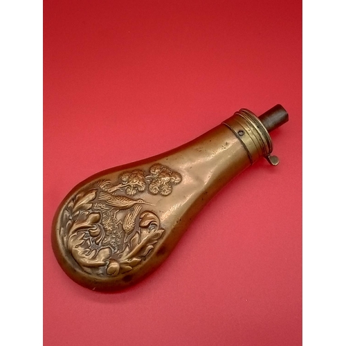 72 - Antique powder flask with ornate design