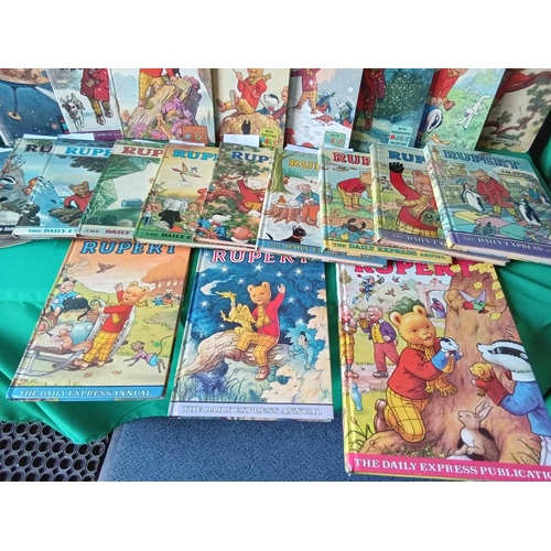 98 - 21 vintage Rupert the Bear annuals dating back to 1953