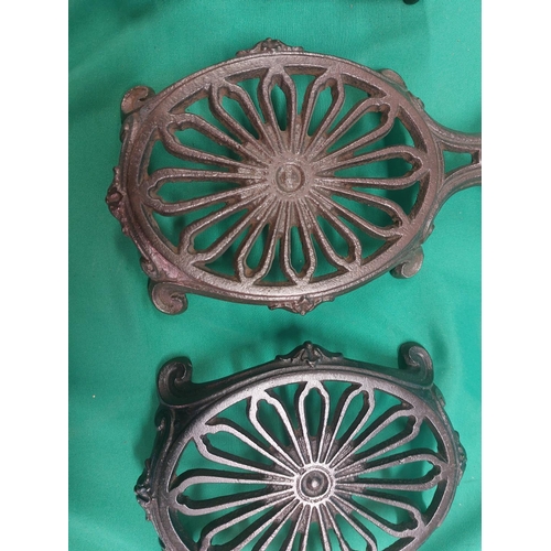 75 - 4 cast iron trivets