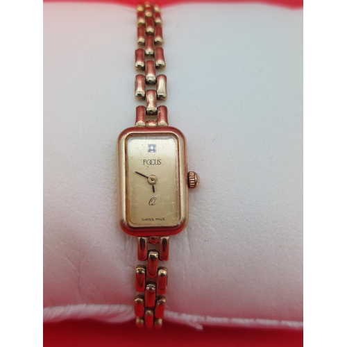 18 - 9ct gold ladies Focus watch 12.9 grams