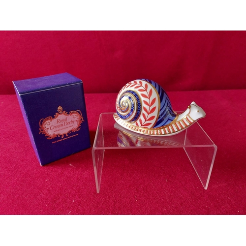 219 - Royal Crown Derby snail paperweight in original box.