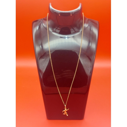 56 - 9ct gold necklace with football pendant 3.3 grams