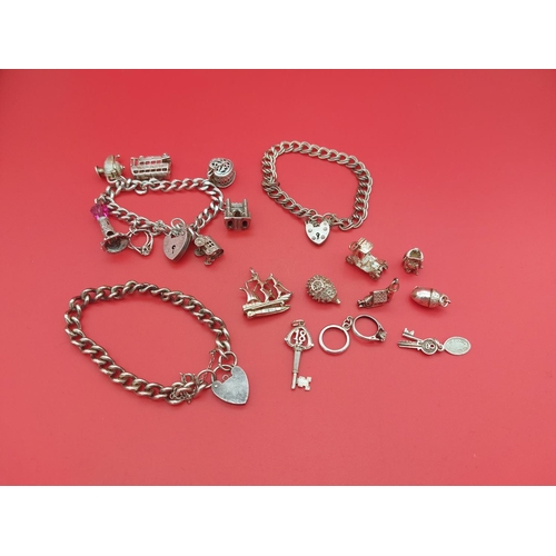 65 - Hallmarked silver charm bracelet with spare charms and 2 other silver bracelets. 110 grams