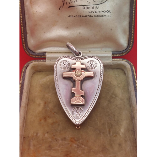 71 - Silver locket with rose gold cross to front and glass back