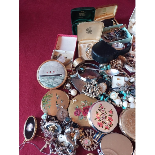 88 - Large collection of costume jewellery with compacts.