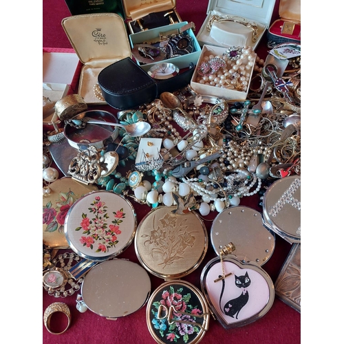 88 - Large collection of costume jewellery with compacts.