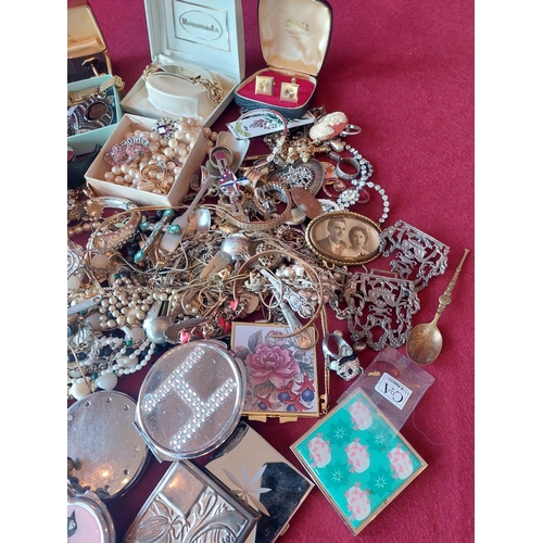 88 - Large collection of costume jewellery with compacts.