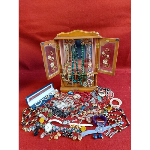 102 - Collection of costume jewellery including wooden cabinet.