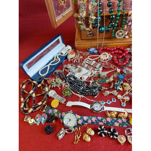 102 - Collection of costume jewellery including wooden cabinet.