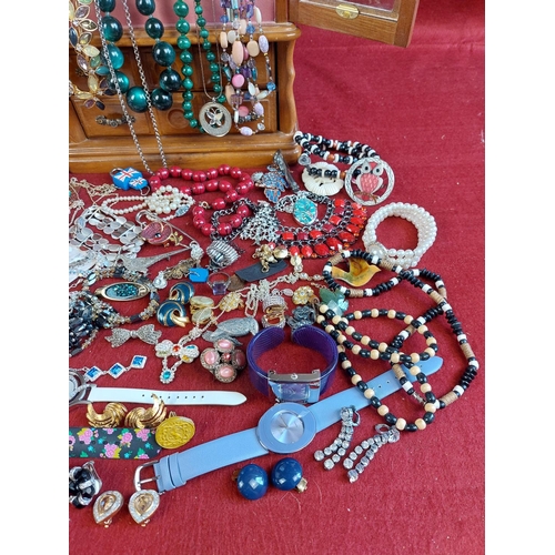 102 - Collection of costume jewellery including wooden cabinet.