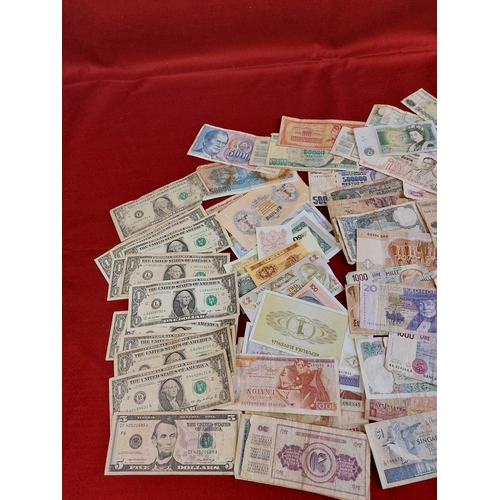 125 - Large collection of banknotes including dollars.