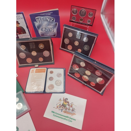 155 - Collection of mixed proof coin sets. UK 1984, 1985 x 2, 1986, USA 1976, 1994 and others.