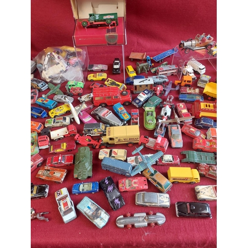 214 - Large collection of playworn die cast model cars and other vehicles. Includes some vintage Dinky toy... 