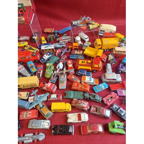 214 - Large collection of playworn die cast model cars and other vehicles. Includes some vintage Dinky toy... 