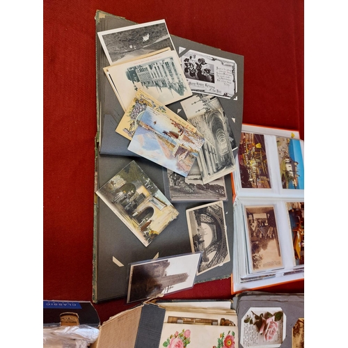 266 - Large collection of postcard albums with cards and loose postcards.