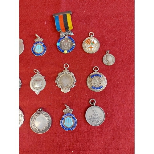 64 - Collection of hallmarked silver fobs and medals 18 in total.