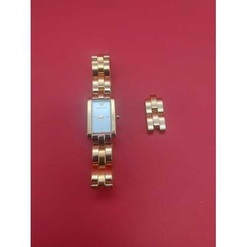 89 - Emporio ladies watch gold tone metal.