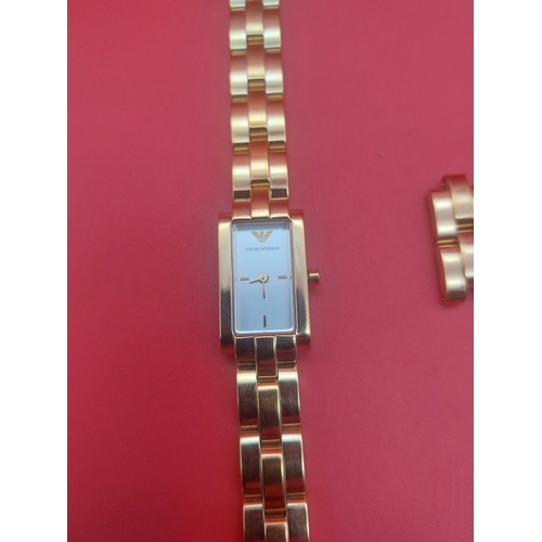 89 - Emporio ladies watch gold tone metal.